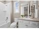 Bright bathroom featuring a shower-tub combination, vanity, and well-lit mirror at 827 Sundance Ln, Erie, CO 80516