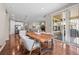 Open dining area with a wooden table, view of the backyard, and the kitchen area at 827 Sundance Ln, Erie, CO 80516