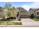 Charming home featuring a well-kept lawn, inviting porch, and a two-car garage at 827 Sundance Ln, Erie, CO 80516