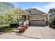 Charming home featuring a well-kept lawn, inviting porch, and a two-car garage at 827 Sundance Ln, Erie, CO 80516