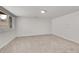 Unfurnished basement area with a bright window, offering potential for customization and versatile use at 8008 W Spanish Peak, Littleton, CO 80127