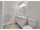 Neutral-toned bathroom with a white vanity and decorative details provides a clean, updated feel at 8008 W Spanish Peak, Littleton, CO 80127