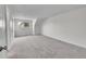 Spacious bedroom featuring neutral carpet, ample natural light, and a double door closet at 8008 W Spanish Peak, Littleton, CO 80127