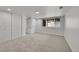 Basement bedroom with large closets and a bright window offers a versatile and comfortable living space at 8008 W Spanish Peak, Littleton, CO 80127