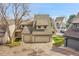 Charming townhome with two-car garage and neutral exterior color at 8008 W Spanish Peak, Littleton, CO 80127
