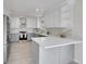 Modern kitchen with stainless steel appliances, two-tone cabinets and breakfast bar at 8008 W Spanish Peak, Littleton, CO 80127
