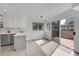 Eat in kitchen with bright white interior and sliding door to deck at 8008 W Spanish Peak, Littleton, CO 80127