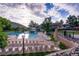 Community pool with lounge chairs, slide, and mountain views at 8008 W Spanish Peak, Littleton, CO 80127