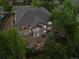Aerial view of a beautiful home with mature trees and landscaping, and outdoor seating area at 19061 Eagle Ridge Dr, Golden, CO 80401