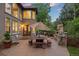 Spacious back patio with stone dining and outdoor kitchen, perfect for entertaining and grilling at 19061 Eagle Ridge Dr, Golden, CO 80401