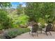 Inviting backyard patio showcasing comfortable seating, lush greenery, and a tranquil outdoor space at 19061 Eagle Ridge Dr, Golden, CO 80401