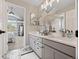 Stylish bathroom featuring double sinks, modern fixtures, and a view of the bedroom at 19061 Eagle Ridge Dr, Golden, CO 80401