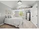 Cozy bedroom featuring a built-in loft bed, neutral paint, and a large window for natural light at 19061 Eagle Ridge Dr, Golden, CO 80401