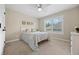 Bright bedroom with a large window, neutral paint, and a ceiling fan at 19061 Eagle Ridge Dr, Golden, CO 80401