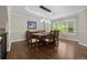 Formal dining room featuring a classic chandelier, chair-rail molding, and hardwood floors at 19061 Eagle Ridge Dr, Golden, CO 80401