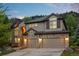 Charming two-story home with a stone facade, arched entryway, and a three-car garage at 19061 Eagle Ridge Dr, Golden, CO 80401