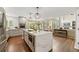 Modern kitchen with a large center island, stainless steel appliances, and hardwood floors at 19061 Eagle Ridge Dr, Golden, CO 80401