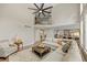Spacious living room featuring high ceilings, a cozy fireplace, and lots of natural light at 19061 Eagle Ridge Dr, Golden, CO 80401