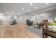 Open-concept living room with beautiful hardwood floors, recessed lighting, and stylish furnishings at 19061 Eagle Ridge Dr, Golden, CO 80401