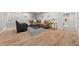 Cozy living room with light hardwood floors, neutral paint, modern furniture, and ample natural light from the window at 19061 Eagle Ridge Dr, Golden, CO 80401