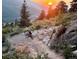 Adventurous outdoor activity showcasing a mountain biker enjoying a scenic trail at sunset at 19061 Eagle Ridge Dr, Golden, CO 80401