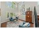 Cozy sitting area with stylish decor, lots of natural light, and hardwood flooring at 19061 Eagle Ridge Dr, Golden, CO 80401