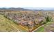 Drone shot highlighting the fenced backyard and neighborhood location with mountain views at 7507 Halleys Dr, Littleton, CO 80125