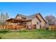 Charming home with a wooden deck, privacy fence, and a well-maintained lawn perfect for outdoor activities at 7507 Halleys Dr, Littleton, CO 80125