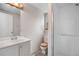 Bright bathroom with modern fixtures, a walk-in shower, and neutral tones for a clean, updated look at 7507 Halleys Dr, Littleton, CO 80125