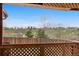 Relaxing patio view overlooks grassy open space and walking trails, with a beautiful blue sky at 7507 Halleys Dr, Littleton, CO 80125