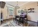 Entertainment area with custom wet bar featuring a chandelier, shelving, and space for seating at 10703 Flagler Dr, Parker, CO 80134