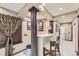 Finished basement bar featuring tile accents, seating, and elegant fixtures, perfect for entertaining guests at 10703 Flagler Dr, Parker, CO 80134
