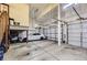 A spacious garage with multiple doors, providing secure parking and extra storage space for vehicles and tools at 10703 Flagler Dr, Parker, CO 80134