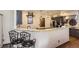 Kitchen with granite counters, stainless steel appliances, pendant lighting and breakfast bar with chairs at 10703 Flagler Dr, Parker, CO 80134