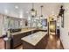 Modern kitchen featuring granite countertops, stainless appliances, and center island with pendant lights at 10703 Flagler Dr, Parker, CO 80134