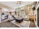 Open living room with cozy seating, bright natural light, and elegant decor at 10703 Flagler Dr, Parker, CO 80134