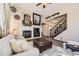 Cozy living room features a fireplace with stone surround, and a comfortable seating arrangement at 10703 Flagler Dr, Parker, CO 80134