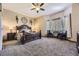 Cozy main bedroom featuring carpet flooring, and a sitting area near the window at 10703 Flagler Dr, Parker, CO 80134