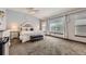 Spacious bedroom featuring vaulted ceilings, plush carpet, and large windows for ample natural light at 10703 Flagler Dr, Parker, CO 80134