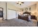 Spacious main bedroom featuring ample closet space, carpet flooring, and natural light at 10703 Flagler Dr, Parker, CO 80134