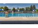A community pool with lifeguard stand and gazebos, perfect for summer relaxation and recreation at 10703 Flagler Dr, Parker, CO 80134
