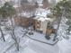 Aerial view of apartment complex covered in snow with bare trees and visible walkways at 2835 S Monaco Pkwy # 4-103, Denver, CO 80222