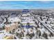 Wide aerial view of a residential area in winter, with buildings, roads, and annotations at 2835 S Monaco Pkwy # 4-103, Denver, CO 80222