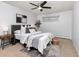 Serene bedroom featuring a comfortable bed, contemporary decor, and ample natural light for a peaceful retreat at 2835 S Monaco Pkwy # 4-103, Denver, CO 80222