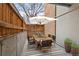 Charming patio with a dining table and a large umbrella for shade, perfect for outdoor entertaining at 2835 S Monaco Pkwy # 4-103, Denver, CO 80222