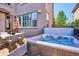 Backyard with hot tub and patio furniture at 9167 E 35Th Ave, Denver, CO 80238