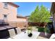 Backyard patio with hot tub and seating at 9167 E 35Th Ave, Denver, CO 80238