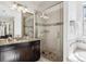 Bathroom with granite vanity and walk-in shower at 9167 E 35Th Ave, Denver, CO 80238