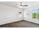 Bright bedroom with ceiling fan and large window at 9167 E 35Th Ave, Denver, CO 80238