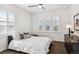 Bedroom with window shutters and dresser at 9167 E 35Th Ave, Denver, CO 80238